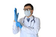 © ty - Man doctor with stethoscope putting a medical gloves on a transparent background