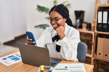 Poster - African american woman business worker using laptop and smartphone at office