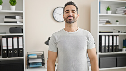 Sticker - Young hispanic man business worker smiling confident at office