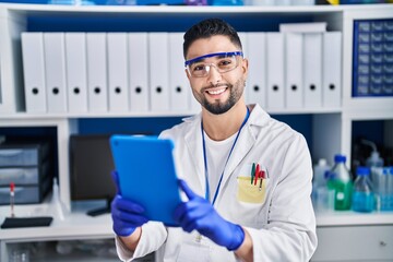 Sticker - Young arab man scientist using touchpad working at laboratory