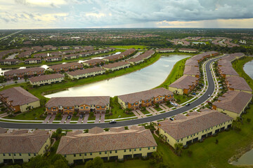 Wall Mural - Aerial view of tightly packed homes in Florida closed living clubs. Family houses as example of real estate development in american suburbs