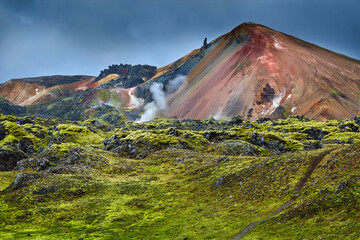 Wall Mural - Valley National Park Landmannalaugar. On the gentle slopes of the mountains are snow fields and glaciers. Magnificent Iceland in the August