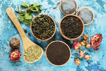 Wall Mural - Different types of tea in a wooden bowl