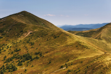 Wall Mural - Amazing landscape scenic mountains in summer. View of light and afternoon shadow over  hills and clear blue sky.