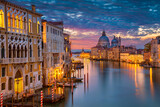 Fototapeta Zachód słońca - Cityscape image of Grand Canal in Venice, with Santa Maria della Salute Basilica in the background.