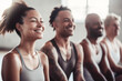 © Jasmina - Group of mixed race smiling people practicing yoga in the gym, close up