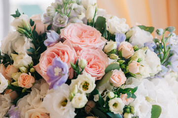 Wall Mural - Wedding decor. Beautiful bouquet with white and pink roses and green leaves, closeup