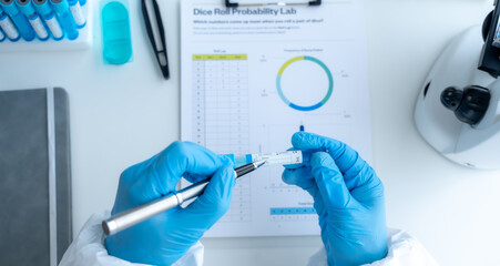 Doctor hand taking a blood sample tube from a rack with machines of analysis in the lab background, Technician holding blood tube test in the research laboratory.