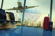 © Designpics - stack of traveling luggage in airport terminal and passenger plane flying over building in city