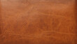 © Uuganbayar - Genuine leather texture background. Dark brown, orange textures for decoration blank.