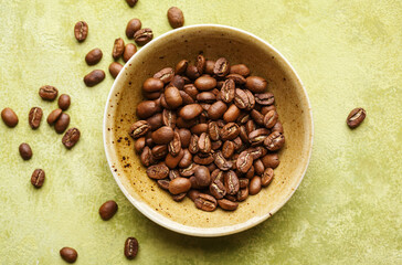 Sticker - Fresh coffee beans in a bowl, top view. Selective focus