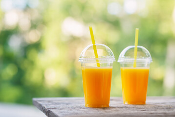 Sticker - Fresh orange juice in the open air. Selective focus.