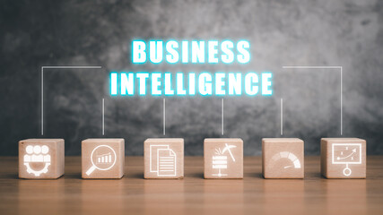 Business intelligence concept, Wooden block on desk with business intelligence icon on virtual screen, data mining, analysis, measurement, benchmarking, report and management.