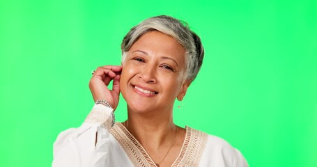 Poster - Beauty, face and senior woman in green screen studio for wellness, skincare and self love on mockup background. Portrait, glowing skin and elderly Indian lady model touching soft dermatology results