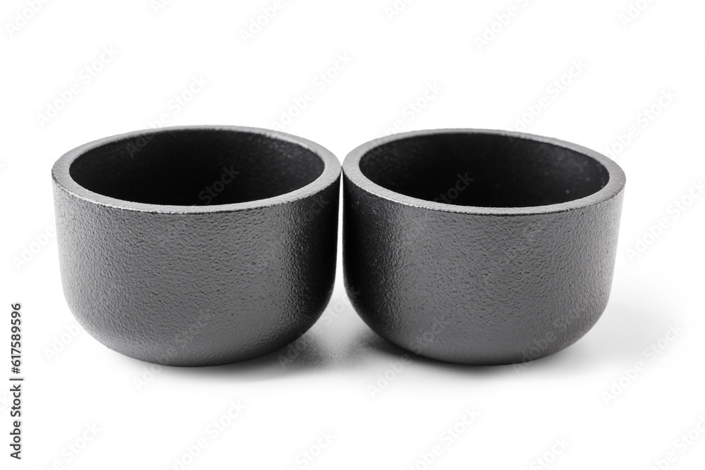 Black tea light candle holders on white background