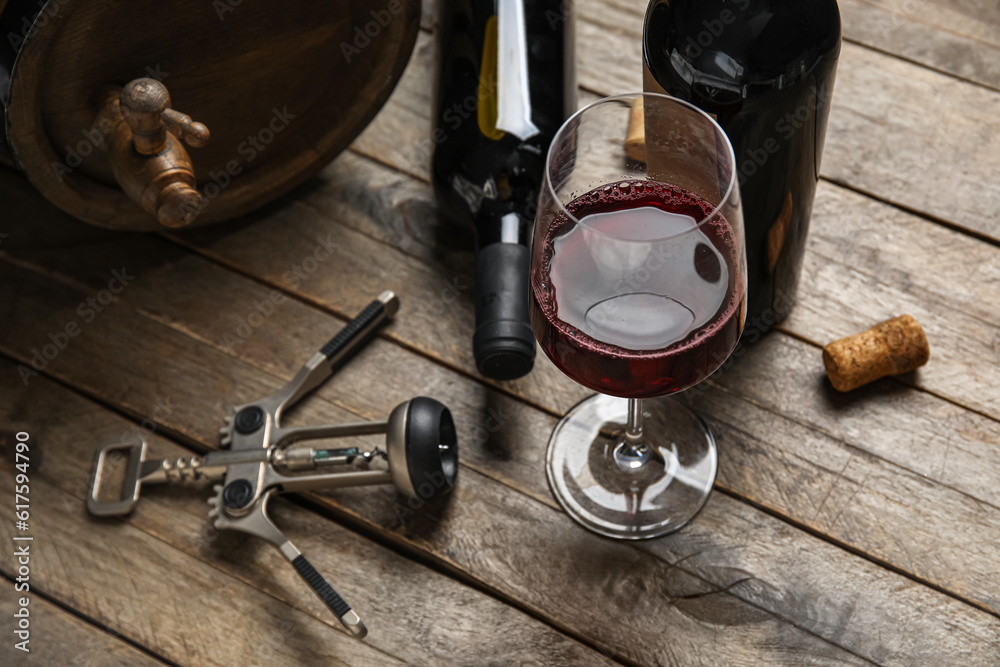 Glass of red wine on wooden background