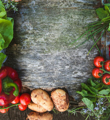 Canvas Print - Healthy food ingredients background. Vegetables, herbs and spices. Organic vegetables on wood