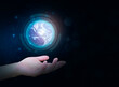 The globe levitates in the person's hand, world day concept. General purpose planet earth isolated On dark blue background. digital technology theme