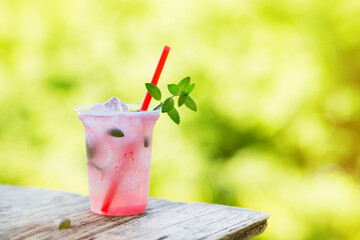 Canvas Print - Lemonade with ice and mint in the fresh air. Selective focus.