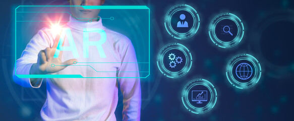 Fototapete - AR technology. Man in white long sleeve t shirt touching on virtual AR screen blue neon light icons. Technology concept.