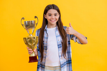 teen girl receive award in studio, thumb up. teen girl accept award on background. proud teen girl w
