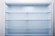 inside of clean and empty refrigerator with shelves background for health or diet concept empty shelves for products new clean refrigerator