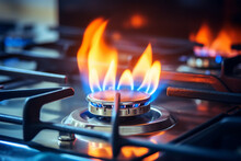 Gas Burning From A Kitchen Gas Stove. Blue Gas Flame On Hob. Closeup  Selective Focus Natural