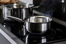 Photo Metal Pot On Induction Hob In Modern Kitchen. Modern Kitchen Pot Cooking Induction Electrical Stove Hob Concept