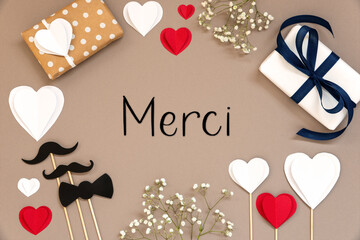 Wall Mural - Flat Lay With Accessories, Gifts, Hearts, Text Merci Means Thank You