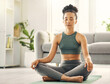Meditation, woman and lotus pose on living room floor for peace, mental health and wellness at home. Yoga, breathing and exercise by female meditating in a lounge for zen, holistic or chakra training
