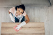 © Lategan/peopleimages.com - Cleaning, table and portrait of a woman in a house to clean with supplies, chemical and cloth. Above young female or cleaner in a lounge, apartment or room with a smile to polish wood or wipe dirt