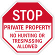 Stop no trespassing warning sign and labels private property. No hunting or trespassing allowed