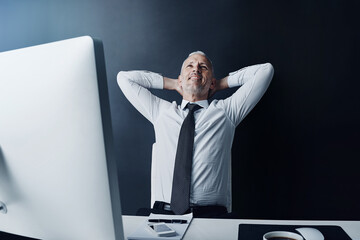 Canvas Print - Elderly business man, pride and relax in office for satisfaction, achievement and smile at finance company. Mature ceo, relief or rest at desk with hands behind head, happy or thinking in workplace