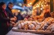 A German Stollen fruit bread with a cheerful Christmas market softly out of focus in the background.