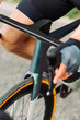 Close-up of cyclist's handlebars and gloved hands. Background. Cycling concept.