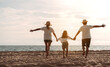 © Kiattisak - Happy asian family enjoy the sea beach. father, mother and daughter having fun playing beach in summer vacation on the ocean beach. Happy family with vacation time lifestyle concept.