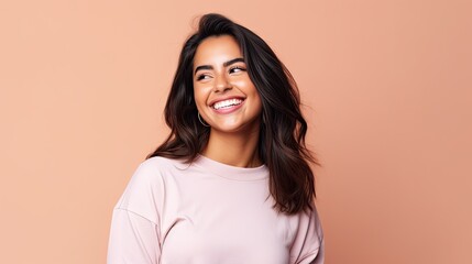 Smiling happy attractive hispanic young woman posing in studio shot