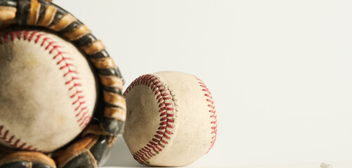 Poster - Baseball sports banner with old used baseball balls and glove on white background.