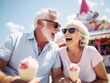 © Anna - Beautiful sweet happy retired gray haired senior couple laughing, smiling, and eating ice cream in amusement park during festival. Generative AI
