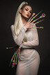 Portrait of a beautiful woman with art make-up in glamorous style, creative long nails. Design manicure. Beauty face.