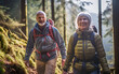 Middle-aged couple happy while hiking together through the forest on a sunny day. Smiling woman and man walking in the nature.