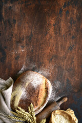 Homemade fresh baked bread with flour and ears.