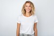 © igolaizola - Portrait of a smiling young woman standing isolated on a white background