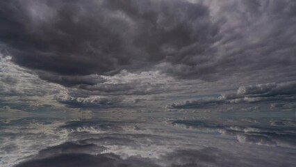 Wall Mural - Water surface in Ultra HD 4K, Loop Footage - View against the sky. sky with evening sky clouds over the sea. Small smooth waves and water reflection