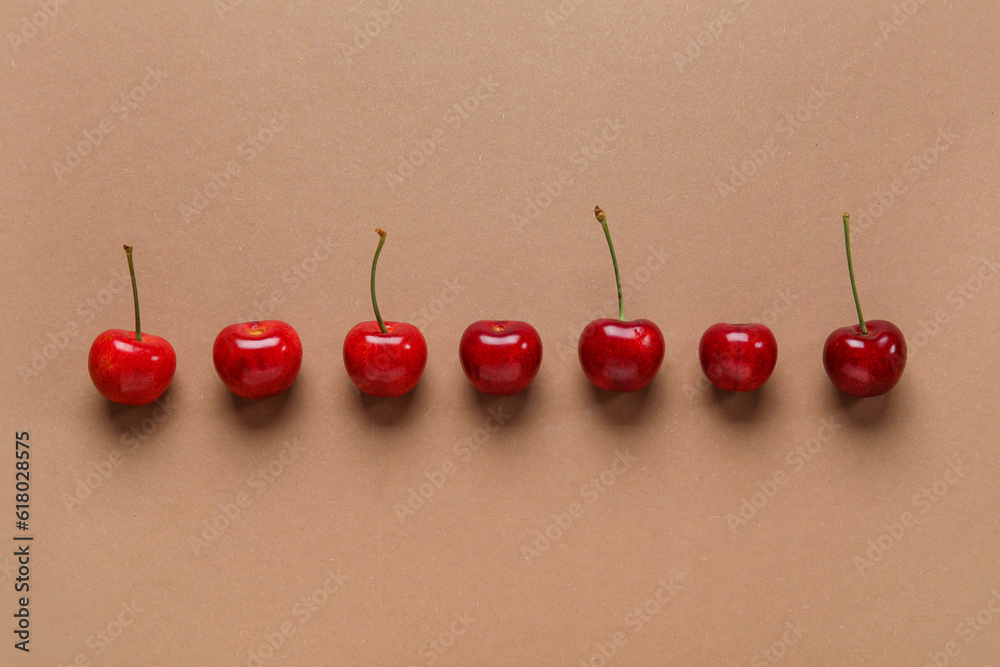 Many sweet cherries on brown background