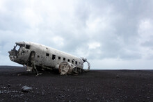 Plane wreckage on a volcano sand beach