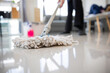 Close up of a woman using a mop to mop the floor cleaning job housewife