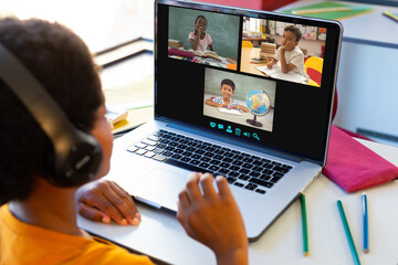 Poster - Happy diverse schoolchildren having class during laptop video call