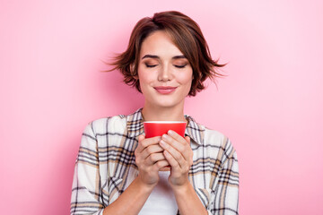 Poster - Photo of adorable shiny woman dressed plaid shirt closed eyes enjoying coffee aroma isolated pink color background