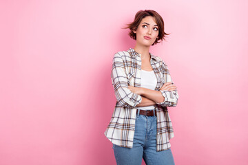 Poster - Photo of serious confident business lady folded arms suspicious read news look empty space distrust isolated on pink color background